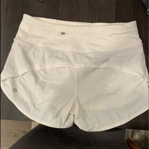 White lululemon speed up shorts. Size 4 and are the longer pair.